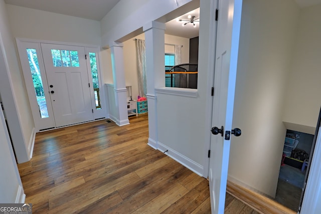 entryway with hardwood / wood-style flooring