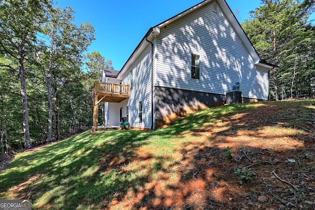 view of home's exterior featuring a yard and central air condition unit