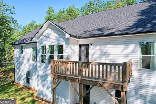 back of house featuring a balcony