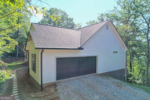 view of side of property featuring a garage