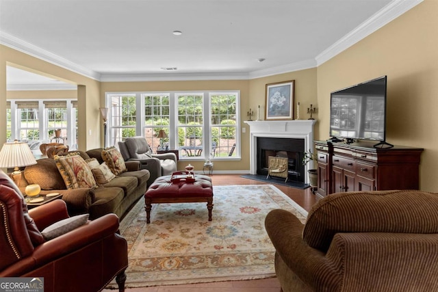 living room featuring light hardwood / wood-style floors and ornamental molding