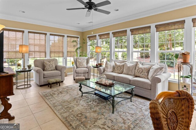 sunroom / solarium featuring ceiling fan