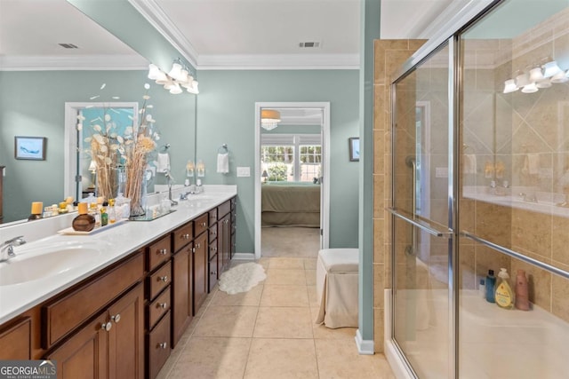 bathroom with tile patterned floors, double sink vanity, crown molding, and a shower with shower door