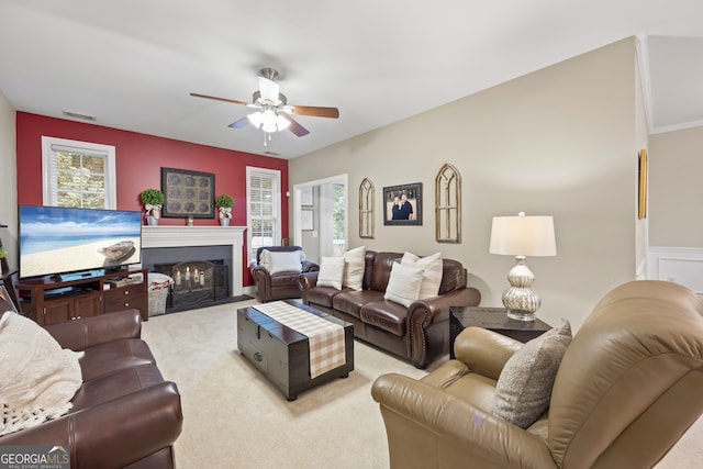 carpeted living room featuring ceiling fan and plenty of natural light