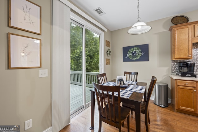 dining room with light hardwood / wood-style floors