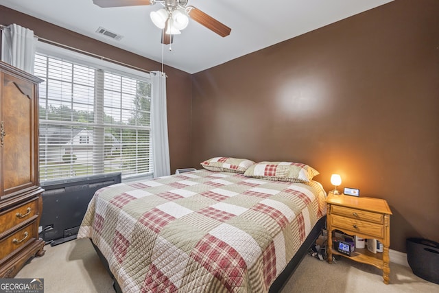 carpeted bedroom featuring ceiling fan