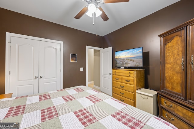 bedroom featuring ceiling fan and a closet