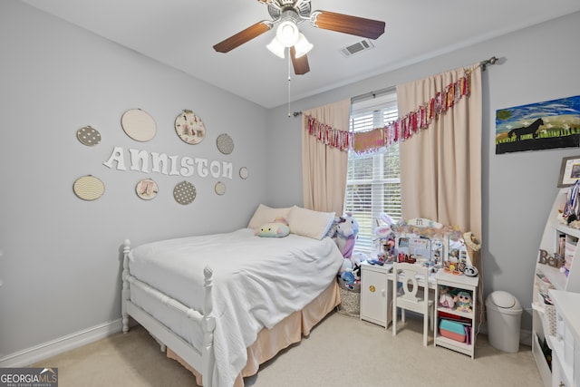 bedroom featuring light colored carpet and ceiling fan