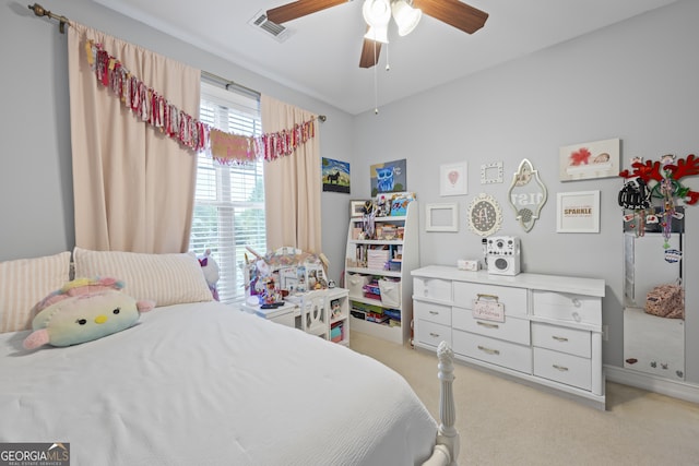 bedroom with ceiling fan and light colored carpet