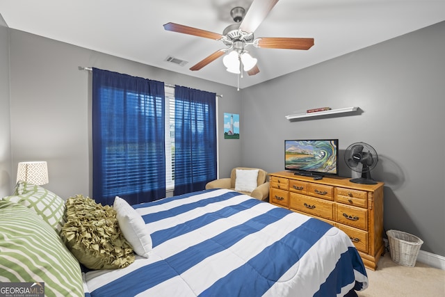 carpeted bedroom featuring ceiling fan