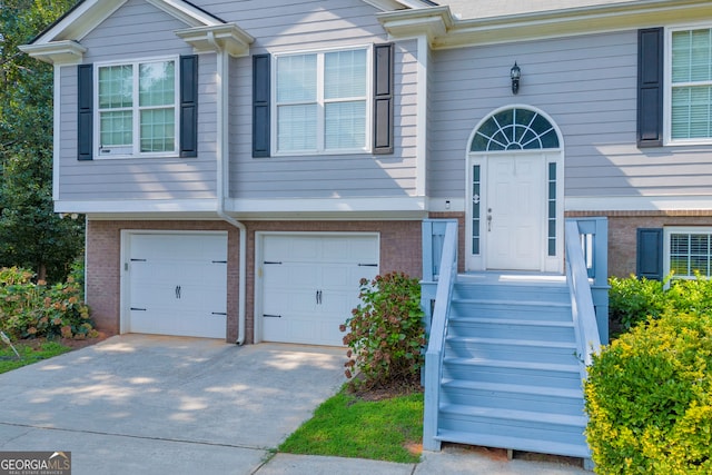 split foyer home featuring a garage