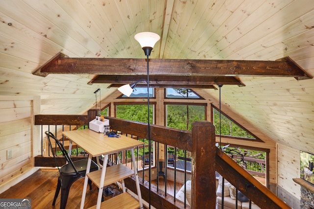 dining area featuring wood walls, lofted ceiling with skylight, wood ceiling, and wood-type flooring