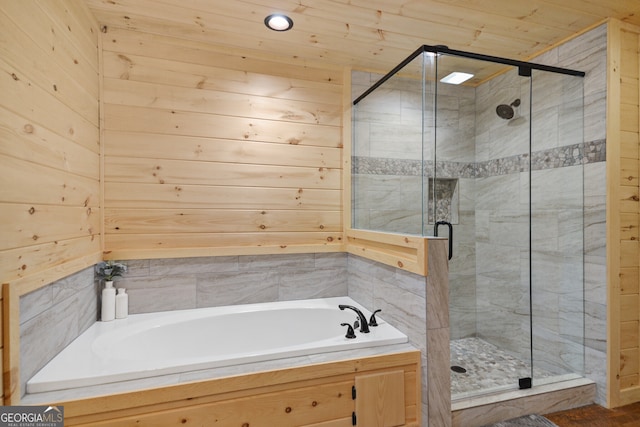 bathroom featuring separate shower and tub, wood walls, and wooden ceiling