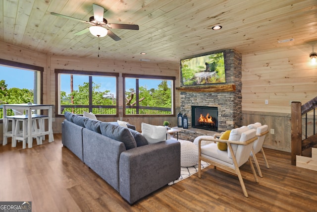 living room with hardwood / wood-style flooring, wood walls, and wood ceiling