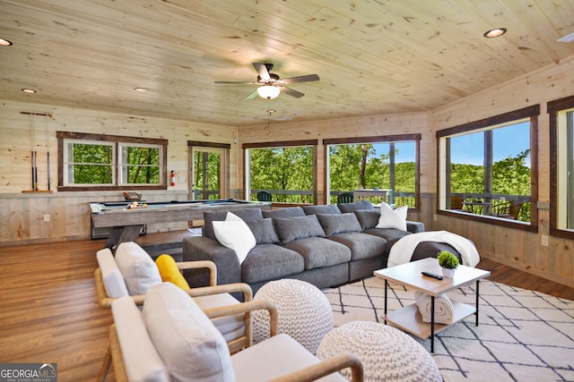 sunroom featuring wood ceiling, plenty of natural light, and ceiling fan