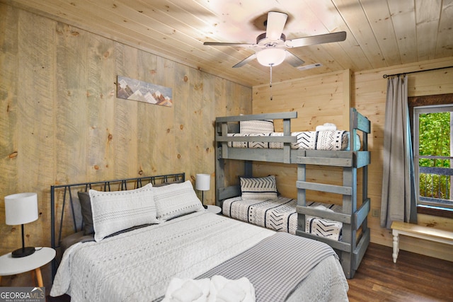 bedroom with wood ceiling, ceiling fan, wooden walls, and wood-type flooring