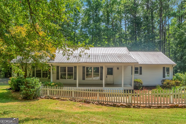 ranch-style house with a front lawn and covered porch