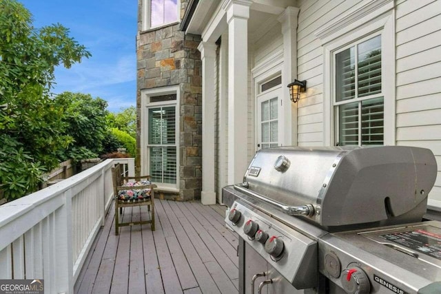 wooden deck featuring grilling area