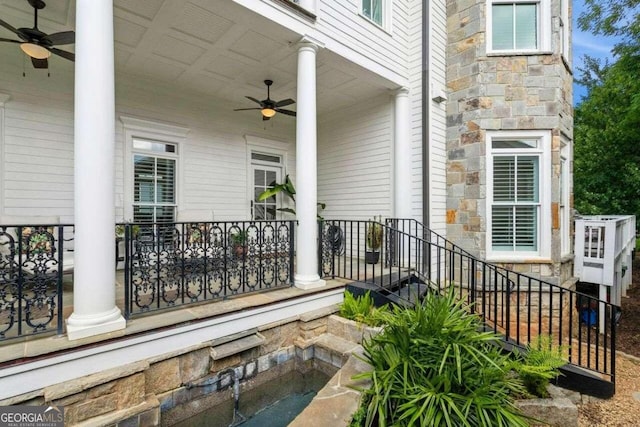 entrance to property featuring ceiling fan