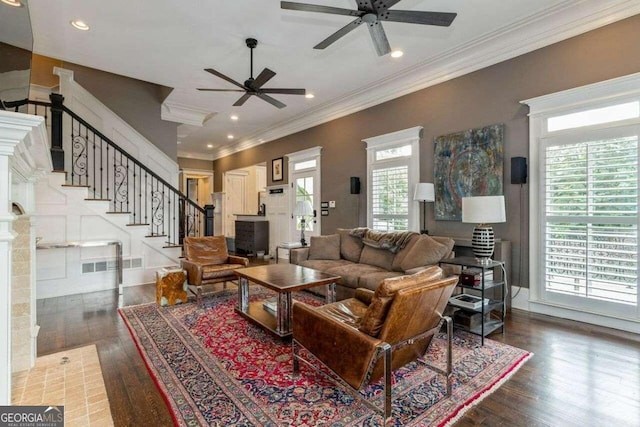 living room featuring ceiling fan, a healthy amount of sunlight, and wood-type flooring