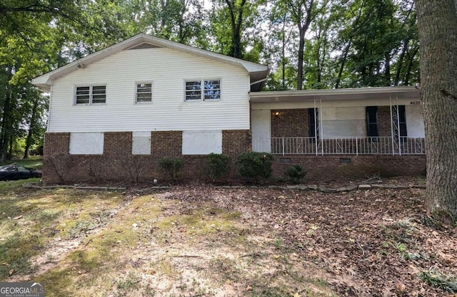 split level home with covered porch