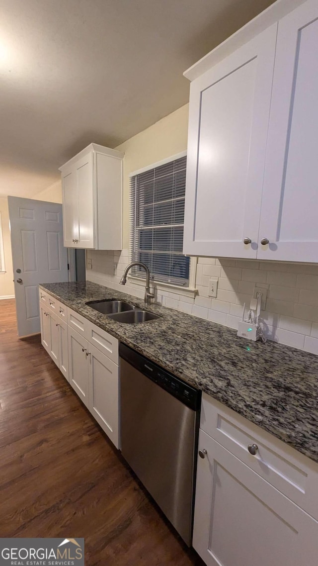 kitchen featuring sink, tasteful backsplash, dark wood-type flooring, and dishwasher