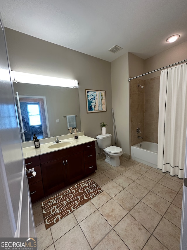 full bathroom featuring shower / tub combo, tile patterned floors, toilet, and vanity