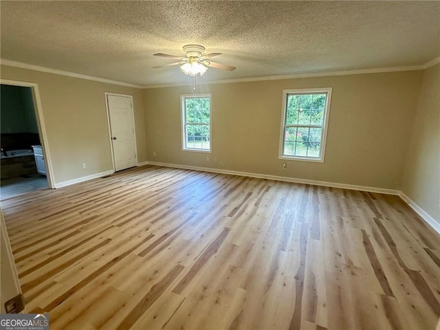 unfurnished room featuring ceiling fan, crown molding, a textured ceiling, and light hardwood / wood-style flooring