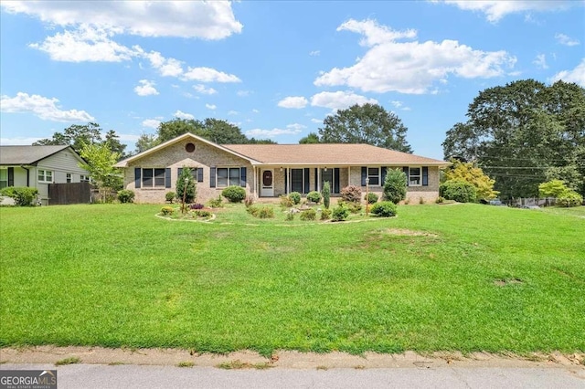 single story home with a front yard