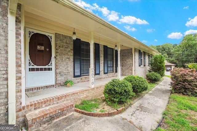 doorway to property with a porch