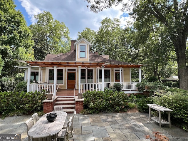 exterior space featuring covered porch and a patio