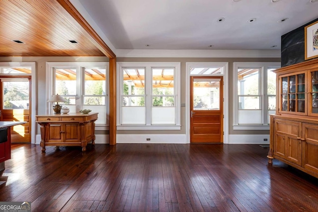 interior space with dark hardwood / wood-style flooring