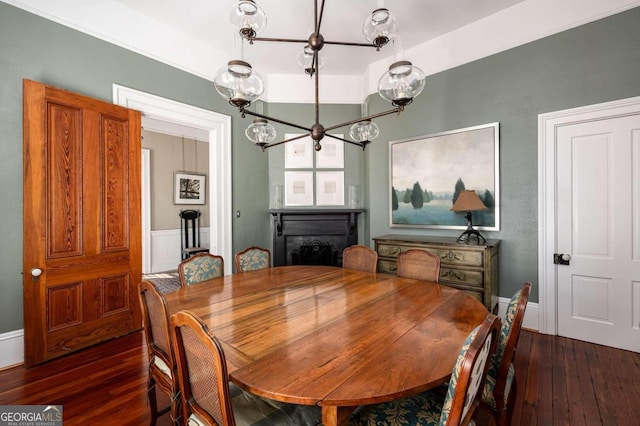 dining room featuring a notable chandelier and dark hardwood / wood-style floors