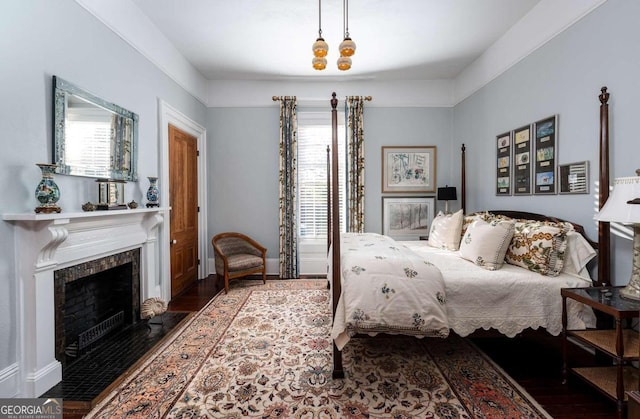 bedroom with dark wood-type flooring