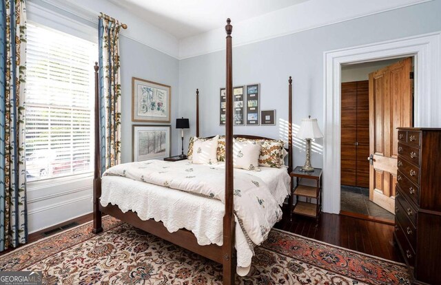 bedroom featuring dark hardwood / wood-style floors