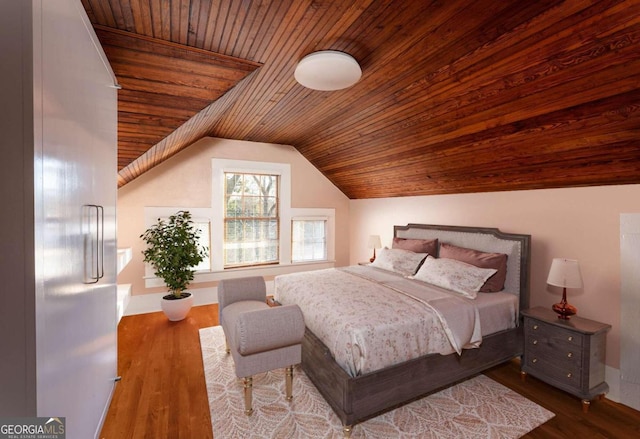 bedroom featuring wood ceiling, lofted ceiling, and hardwood / wood-style flooring