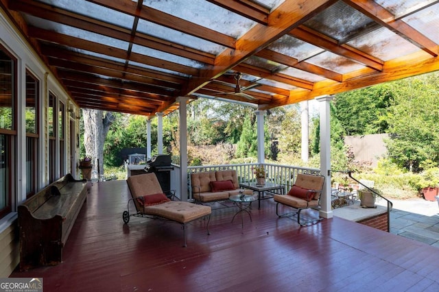 view of patio featuring a pergola, area for grilling, and a deck