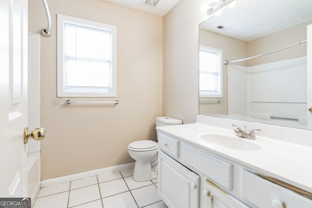 full bathroom with tile patterned flooring, plenty of natural light, vanity, and toilet