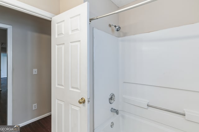 bathroom featuring shower / bath combination and wood-type flooring