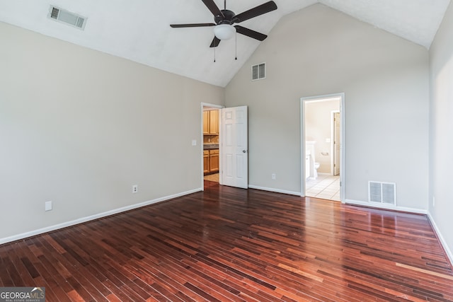 unfurnished bedroom featuring ceiling fan, high vaulted ceiling, connected bathroom, and tile patterned flooring