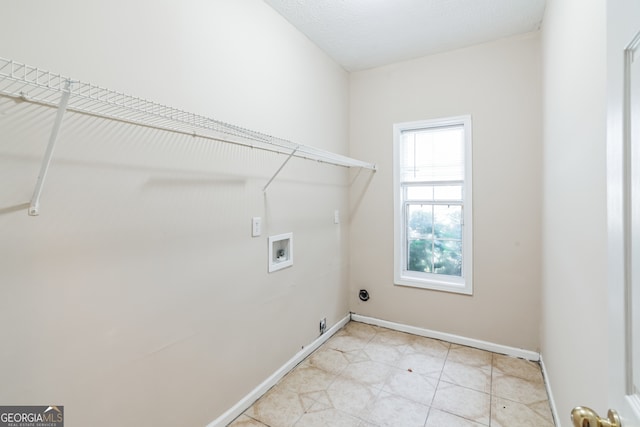 laundry area featuring light tile patterned flooring and hookup for a washing machine