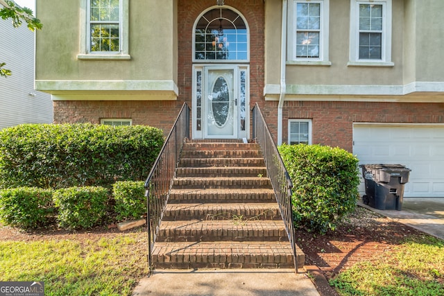 view of exterior entry with a garage