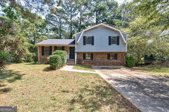 tri-level home with a front yard