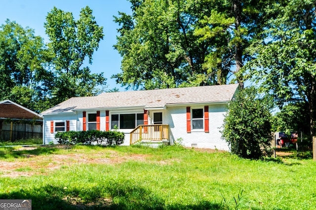 ranch-style house with a front yard