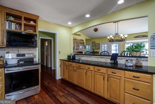 kitchen with dark stone counters, backsplash, stainless steel electric range oven, and dark hardwood / wood-style floors