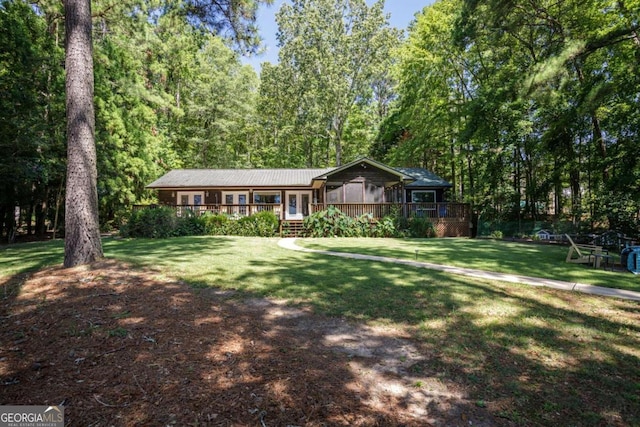 ranch-style house with a front lawn