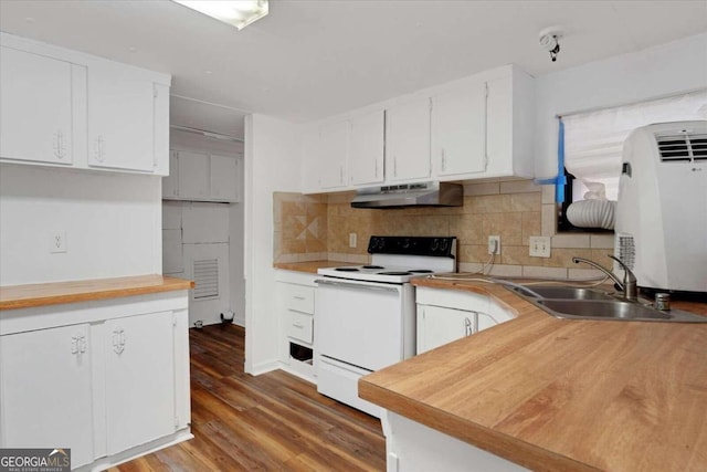 kitchen with white cabinets, decorative backsplash, white electric stove, and sink