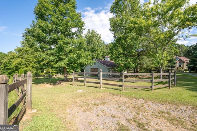 view of yard with a rural view