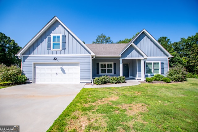 view of front of home featuring a garage and a front lawn