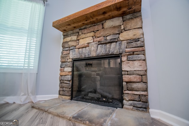 details with a fireplace and hardwood / wood-style floors